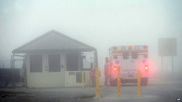 An Okaloosa County ambulance sits at the Eglin Air Force entrance in Fort Walton Beach, Florida 10 March 2016